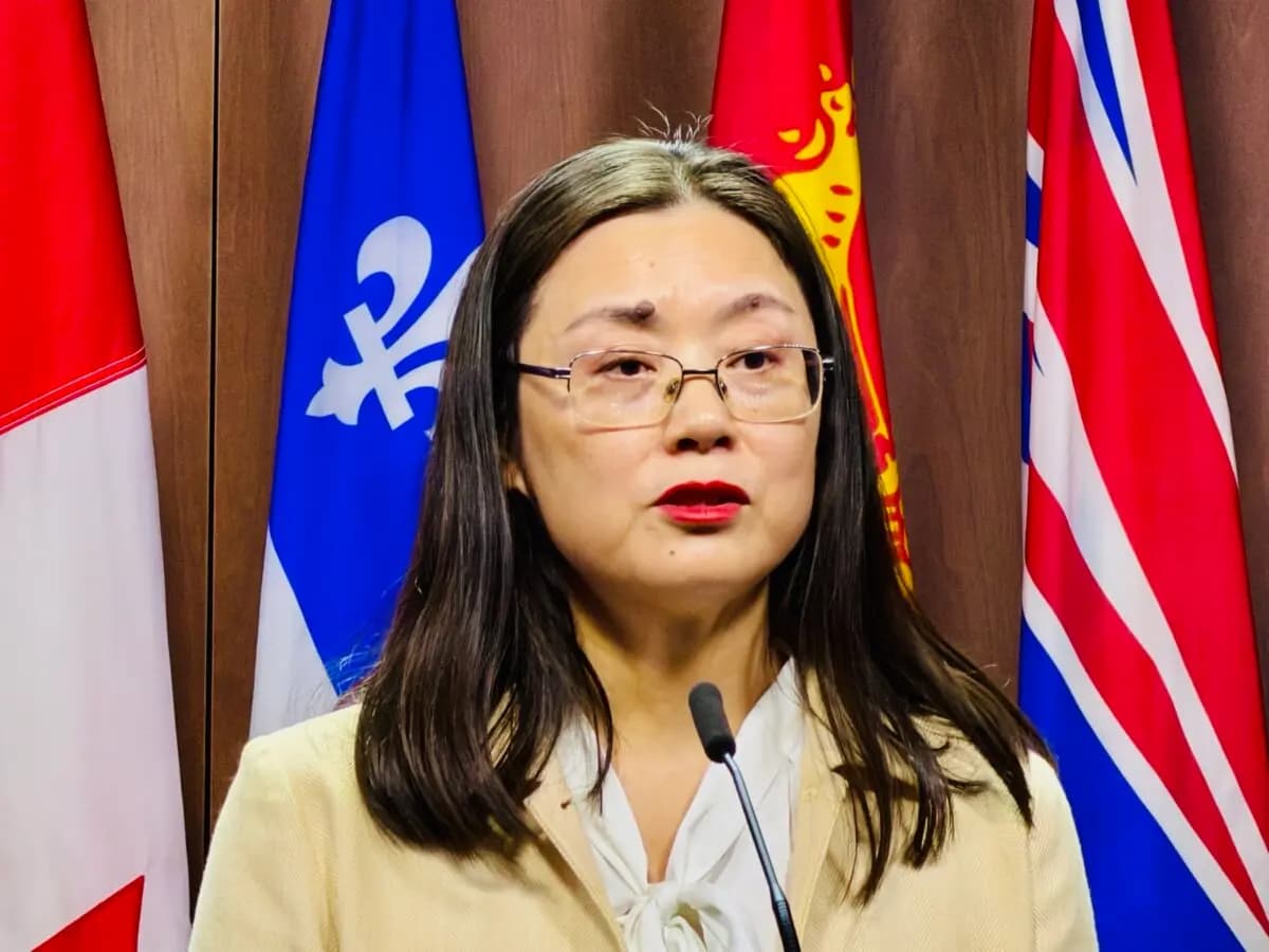 Kelly Cong, a Falun Dafa practitioner whose mother was arbitrarily detained in China in February 2023 and sentenced to four years in prison, speaks at a press conference on Parliament Hill in Ottawa on May 28, 2026 (The Epoch Times)