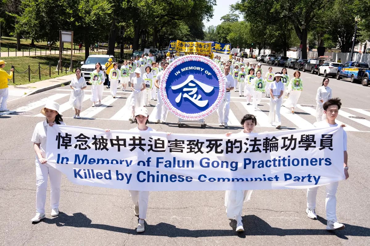 Falun Dafa practitioners take part in a march calling for the end of the Chinese Communist Party’s 27 years of persecution of Falun Gong in China, in Washington on July 23, 2026. (Larry Dye/The Epoch Times)